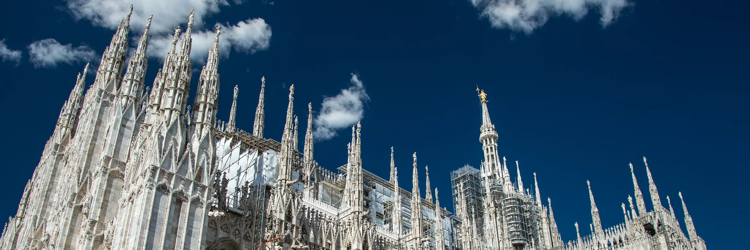 Milan: The spires of the cathedral, with the gilded Madonna on the tallest